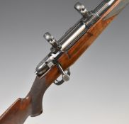 RWS 7x64 bolt-action rifle with chequered semi-pistol grip and forend, raised cheek piece, scope