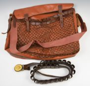 Leather game bag and shotgun cartridge belt.