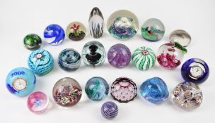 Twenty-two glass paperweights including Murano, Caithness, Strathearn and Selkirk magnum, one with