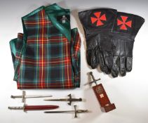 Knights Templar / Masonic sword paper knives, one in wooden holder, together with a pair of