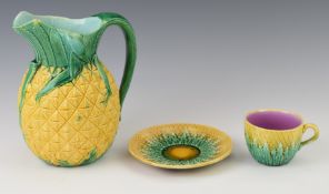 19thC majolica jug and a cup and saucer, tallest 20cm