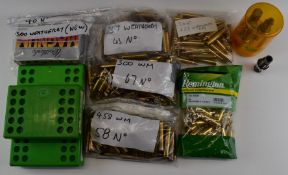Four rifle cartridge re-loading die sets .340 .300 and .257 Wea Mag and related empty brass cases.