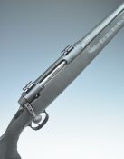 Savage Axis .243 bolt-action rifle with composite stock, semi-pistol grip, sling and scope mounts