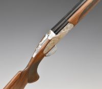 Huglu 103 CE 20 bore over and under ejector shotgun with engraved and gilt scenes of birds to the