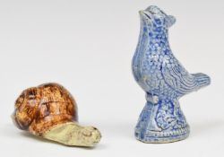 Faience pottery figural cockerel whistle and a figure of a snail, both with old Sotheby's labels