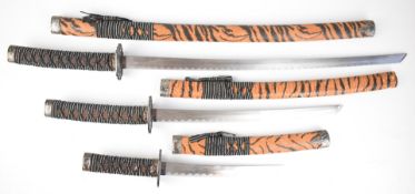 Set of three copy / replica Japanese Samurai swords, all with scabbards, longest blade 65cm.