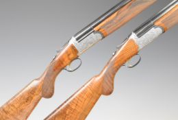 A pair of Rizzini Round Body 12 bore over and under ejector shotguns each with finely engraved