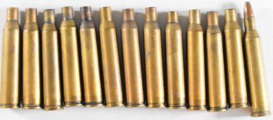 Fourteen rounds of fired .220 Swift rifle cartridges