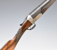W P Jones 12 bore single barrelled shotgun with named lock, chequered grip and forend, vacant