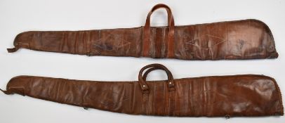 Two leather shotgun or rifle slips, both with wool lined interiors.