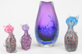 Three Svaja glass cats together with a Jane Charles studio glass vase with blue mottled