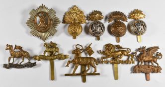 Ten British Army Infantry metal cap badges including the Royal Scots, Queens, The Buffs, King's