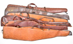 Nine leather and faux leather shotgun or rifle slips including Browning.