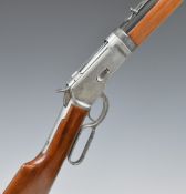 Winchester style lever action replica rifle with wooden stock and base metal action, 97cm long.