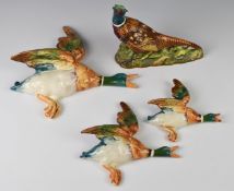 Three Beswick mallard duck wall plaques, models 1, 3 & 4, and a pheasant model 1226, tallest 21cm