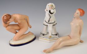 Royal Dux nude figurines and German porcelain figure of two Pierrots embracing, tallest 19cm
