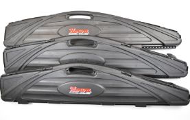 Three rifle or shotgun hard carry or flight cases comprising two Howa and one Fambeau, all with