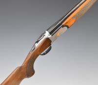 Lincoln Premier 12 bore over and under ejector shotgun with gold decoration of birds to the locks,