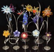 Thirteen Swarovski Crystal glass flowers, all on metal stands, largest 24.5cm tall.
