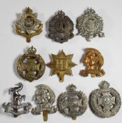 Ten British Army Infantry cap badges including the Artists Rifles, London Rifle Brigade, Tower