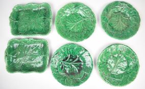 Six 19thC majolica plates and shaped dishes with leaf decoration.