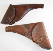 Two leather revolver gun holsters, one named possibly Rowe & Sons Ltd, largest 36cm long.