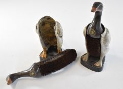 Pair of novelty shoe or similar brushes formed as ducks, each painted with Kynoch trade mark gun