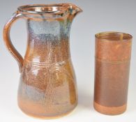 Robin Welch studio pottery sleeve vase and a studio pottery jug, tallest 24cm