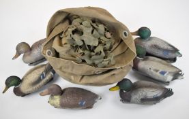 Six Sport Plast and Carry Lite floating duck decoys and hide webbing, in a canvas bag