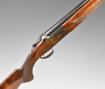 Miroku 12 bore over and under ejector shotgun with engraved locks and underside, chequered semi-