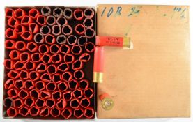 Approximately one hundred and twenty 10 bore shotgun cartridge cases.