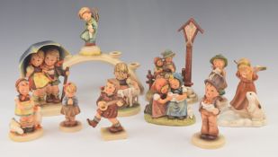 A collection of Goebel Hummel figures including candelabra, tallest 21cm