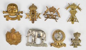 Eight British Army Cavalry Regiment badges including 17th and 21st Lancers and 15th, 18th, 19th