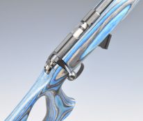 CZ 455 .22 bolt-action rifle with semi-pistol grip and raised comb to the laminate show wood