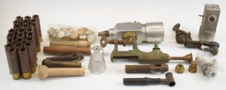A collection of re-loading items including powder measures, rollover tool, dies, cartridge cases