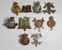 Ten British Army Cavalry Regiment badges including Inniskilling Dragoons, 5th and 9th Lancers, 4th