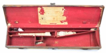 Leather and canvas bound shotgun carry case with remnant of original label, 76 x 18 x 8cm.