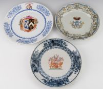A set of three armorial plates, two with Chinese marks verso, largest diameter 30cm