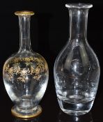 Two glass decanters, one Baccarat with gilt decoration the other Villeroy and Boch, both with etched
