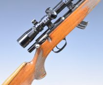 Krico .22 bolt-action rifle with chequered semi-pistol grip and forend, raised cheek piece to the