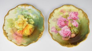 Pair of Royal Doulton cabinet plates decorated with roses, signed Harry Piper, diameter 23.5cm