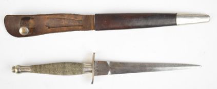 Fairbairn Sykes first pattern fighting knife with chequered grip and distinctive crosspiece, stamped
