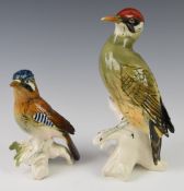 Karl Ens woodpecker and jay bird figures and Lladro doves, tallest 25cm