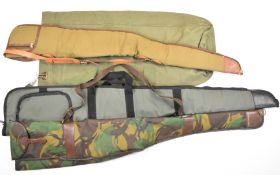 Three padded shotgun or rifle slips and a canvas game or decoy bag.