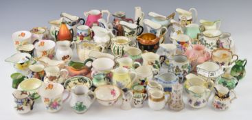 A large collection of decorative mainly porcelain jugs including Royal Doulton (approximately 25),