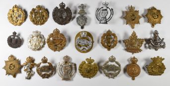 A small collection of badges including Royal Tank Corps, Royal Armoured Corps, Royal Air Force,