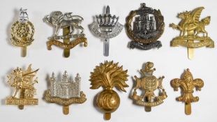 Ten British Army Infantry badges including 1st Volunteer Battalion Dorsetshire Regiment,