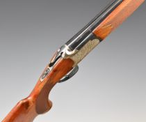 Lanber 12 bore over and under ejector shotgun with engraved lock, trigger guard, thumb lever, top