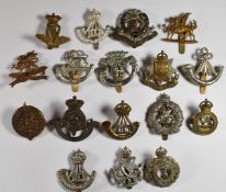 Seventeen British Army Infantry badges including Durham Light Infantry, East Surrey Regiment,