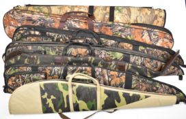 Seven padded shotgun or rifle slips, all with camouflage finish.